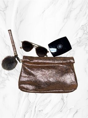 Miss Albright Metallic Rose Gold Wristlet Clutch with Pom Pom Accent